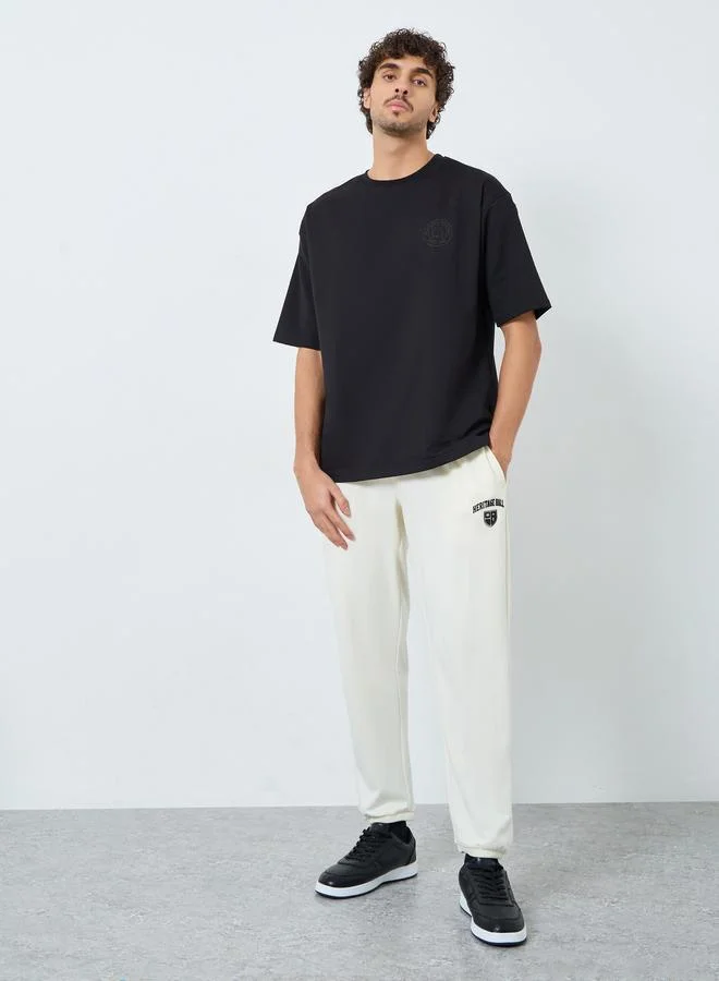 Men Cream Pocket Print Terry Joggers